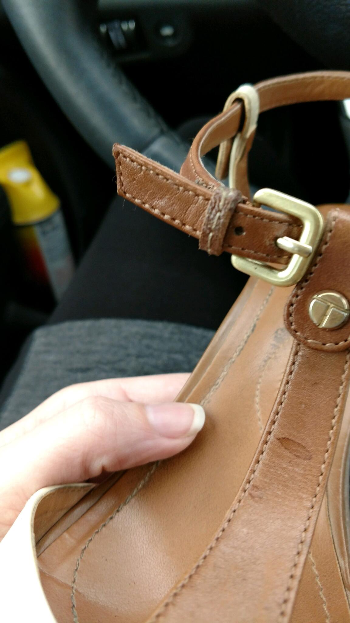 Leather sandal buckle and stitching detail